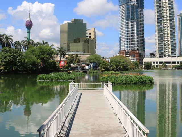 A city park in Colombo, Sri Lanka, with the city skyline in the background