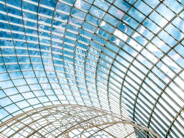 A glass building with a round ceiling