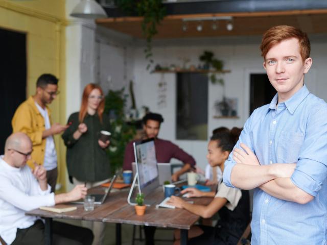 Young professionals looking at a laptop