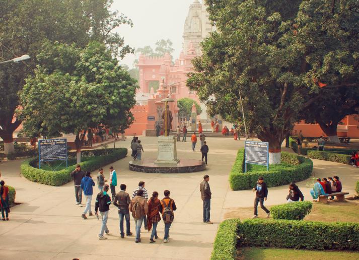 A group of students walking through a university campus in India