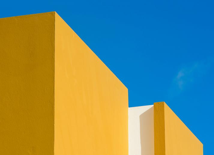 Two yellow blocks against a blue background