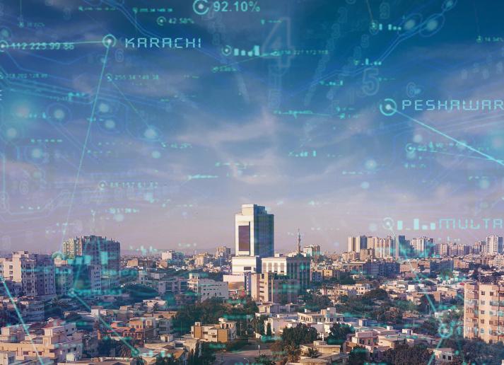 The city of Karachi, Pakistan with neon technological text overlayed