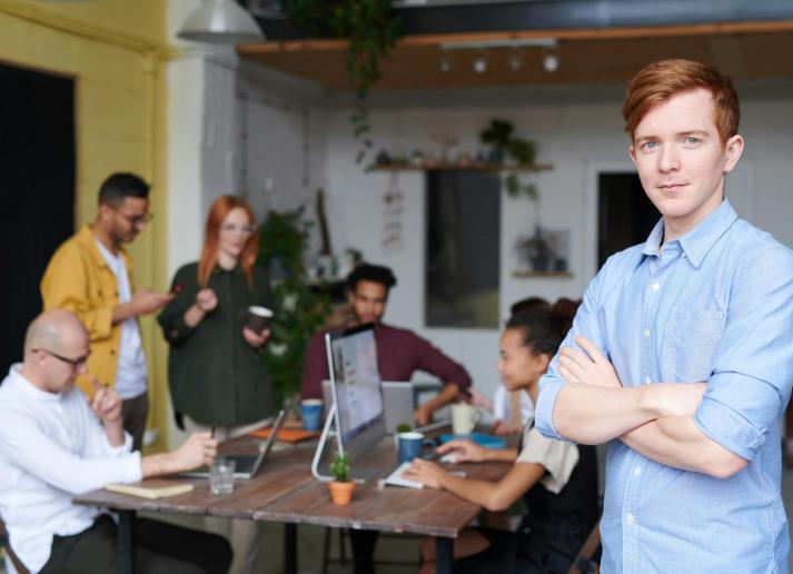 Young professionals looking at a laptop