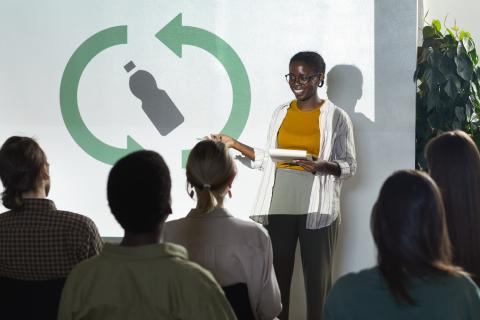 Woman presenting on green topic