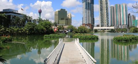 A city park in Colombo, Sri Lanka, with the city skyline in the background